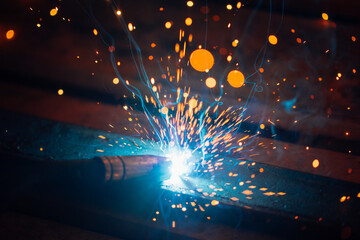 Poster - artistic welding sparks light, industrial background