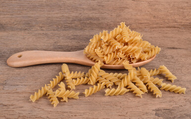 Wall Mural - macaroni on a wood background