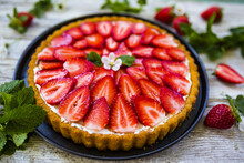 Delicious Sponge Cake With Jelly And Fresh Strawberries On A Wooden Background. 