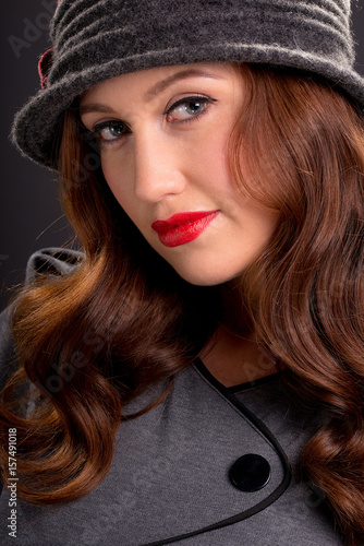 Vintage Style Portrait Of Beautiful Young Woman Wearing A Cloche