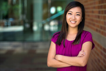 Genuine natural headshot portrait of mixed ethnicity feminist woman standing strong powerful confident