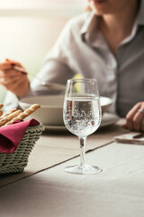 Wall Mural - Woman having lunch at the restaurant, food and lifestyle concept