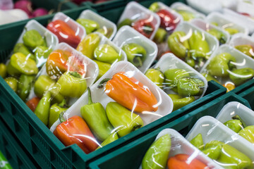 Bulgarian pepper in a box on a shelf in a supermarket