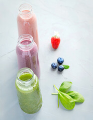  Variations of Smoothies in Bottles on Grey Background Healthy Drink