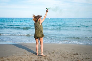 Wall Mural - Beautiful girl outdoor with with smoke bomb