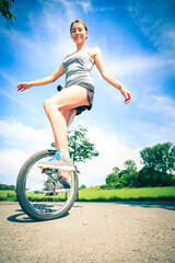 Young Woman Riding Her Unicycle