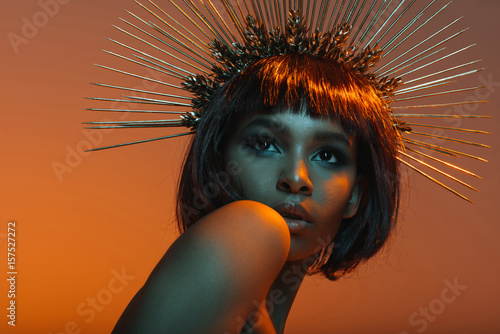 Plakát stylish african american girl posing in headpiece with needles