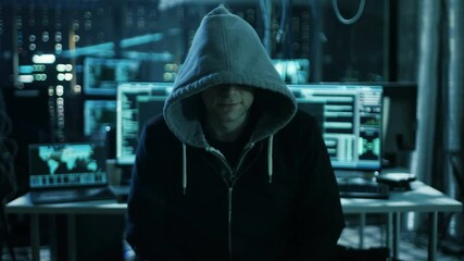 Aufkleber - Dangerous Internationally Wanted  Hacker Speaks into the Camera. In the Background His Operating Room with Multiple Displays and Cables. Shot on RED EPIC-W 8K Helium Cinema Camera.