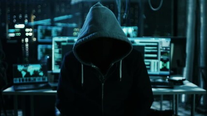 Aufkleber - Dangerous Internationally Wanted Hacker with Covered Face Speaks into the Camera. In the Background His Operating Room with Multiple Displays and Cables. Shot on RED EPIC-W 8K Helium Cinema Camera.
