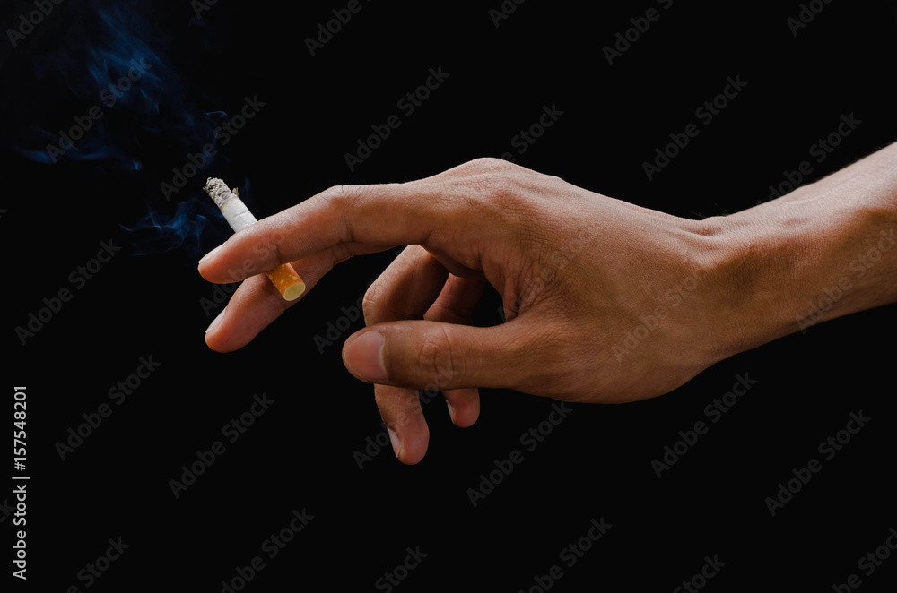 cigarette holding hand hand holding cigarette and smoke on black Stock Photo