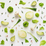Fototapeta Tulipany - Fresh vegetables on a white background. Vegetable food background. Pattern of cabbage, radish, lettuce, green pepper, young garlic, sorrel. Top view.