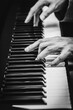 © princeoflove - male musician hands playing on piano keys, black and white. music background