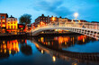 Dublin, Ireland. Night view of famous illuminated Ha Penny Bridge