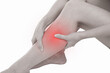 © jayzynism - Woman with calf feeling pain on white background.