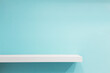 © jayzynism - Empty white shop shelf, retail shelf on blue vintage background.