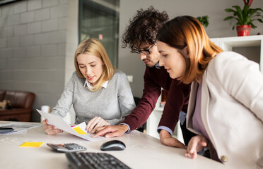 Canvas Print - happy business team with papers in office