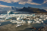 Fototapeta Natura - Beautiful view of icebergs in Jokulsarlon glacier lagoon, Iceland, global warming concept, selective focus
