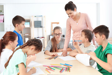 Poster - Female teacher conducting lesson in classroom