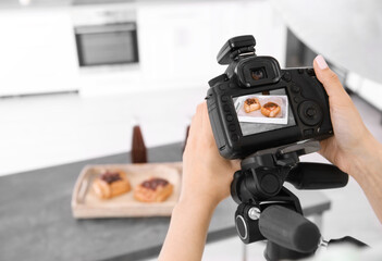 Wall Mural - Young woman photographing food in photo studio, closeup