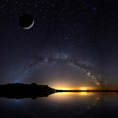 amazing panoramic landscape view of a milky way. milky way over the lake.