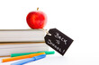 © CreativeFire - Back to School - Red Apple, books and pens - with blackboard handwritten chalk label