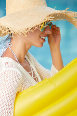 Canvas Print - Young happy woman relaxing in a swimming pool