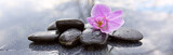 Fototapeta Desenie - Spa stones and pink orchid on gray background.