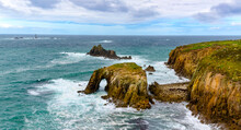 Enys Dodman, A Rock Arch About 1km South Of Lands End, The Armed Knight And The Longships Reef Can Be Seen Beyond.