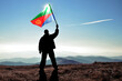 Successful silhouette man winner waving Eritrea flag on top of the mountain peak