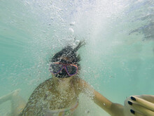 Girl With Snorkeling Mask Makes Bubbles And Posing The Camera