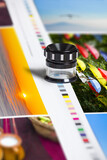 Fototapeta Paryż - Color patch bars on offset print sheet and magnification loupe