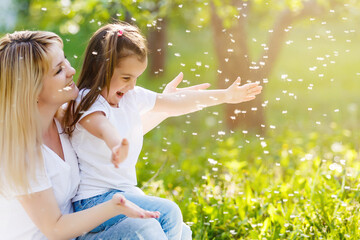 Wall Mural - Mother and daughter in field with colorful flowers