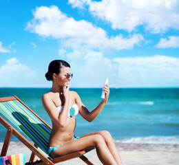 Canvas Print - Beautiful and sexy woman in bikini relaxing on beach. Traveling, holiday, vacation concept.