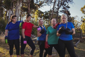 Wall Mural - Group of fit women relaxing together in the boot camp