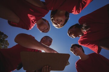 Wall Mural - trainer instructing kids in the boot camp