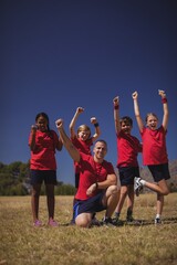 Wall Mural - trainer and kids relaxing in the boot camp
