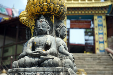 Wall Mural - Buddhas near entrance of monastery