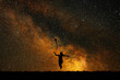 © callisto - Silhouette joyful girl on a background of stars, the concept of joy and happiness.