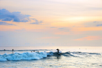 Wall Mural - Surfing on Bali at sunset