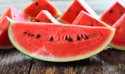 Wall Mural - watermelon sliced on wooden background