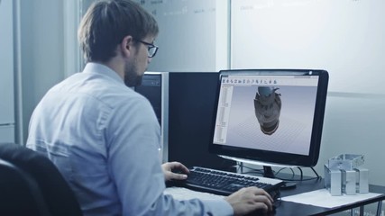 Serious Engineer Working on CAD Program in His Minimalistic Office.Shot on RED Cinema Camera 4K (UHD).