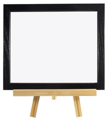 Wall Mural - Blank black wood frame on presentation easel. Copy space. Isolated. Horizontal.