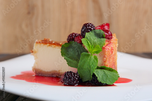Fényképezés Piece of cheesecake with cherry, strawberry