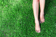 © mraoraor - Woman legs relax feeling on green grass background with light of sun
