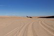 U.S. / Mexico border wall stretching along Imperial Sand Dunes