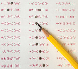 Wall Mural - yellow pencil on exam answer sheet, education test concept