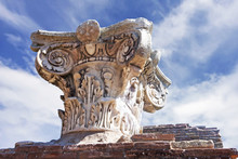 Ancient Roman Capital Close Up In Archaeological Excavations Of Ostia Antica - Rome - Italy