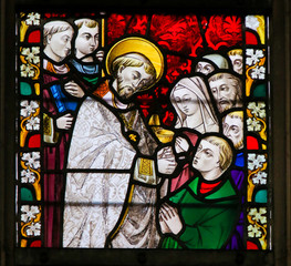 Wall Mural - Stained Glass - Priest giving Holy Communion