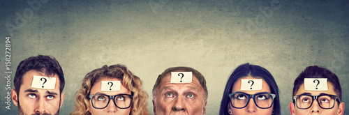 Cuadros en Lienzo Multiethnic group of thinking people with question mark looking up