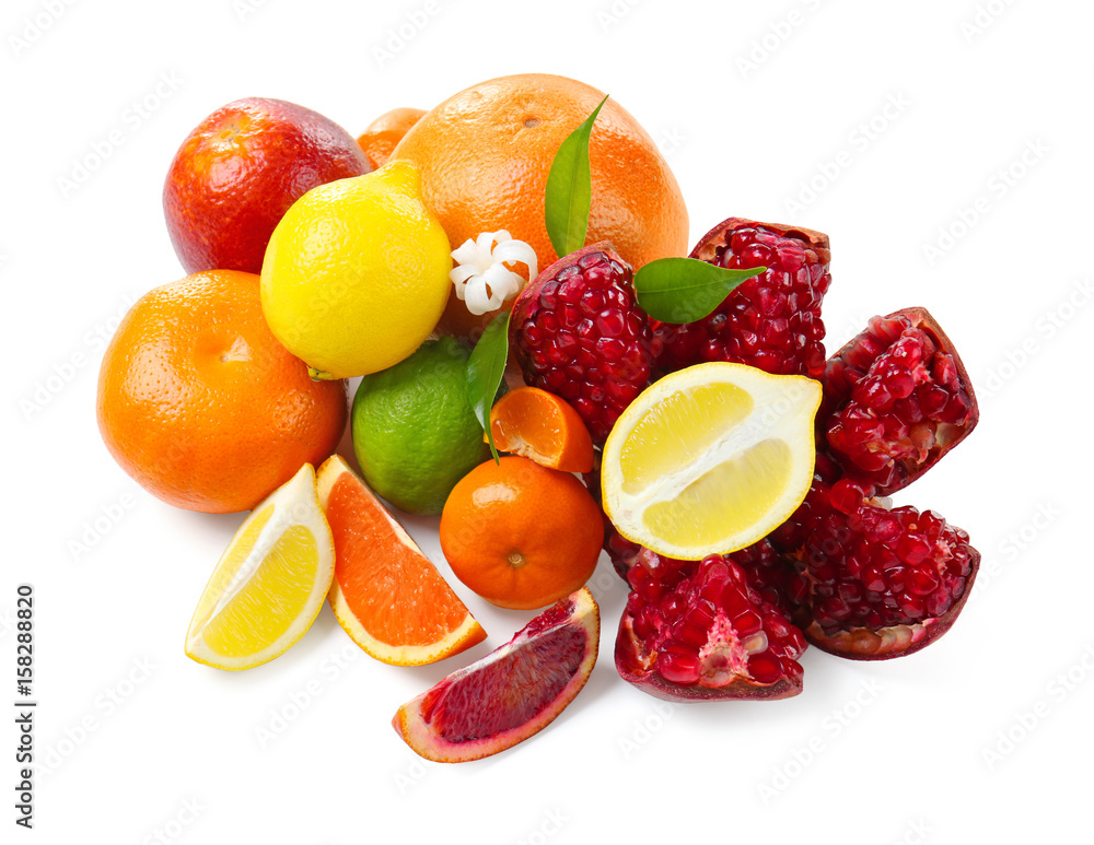 Composition of pomegranate and citrus fruits on white background
